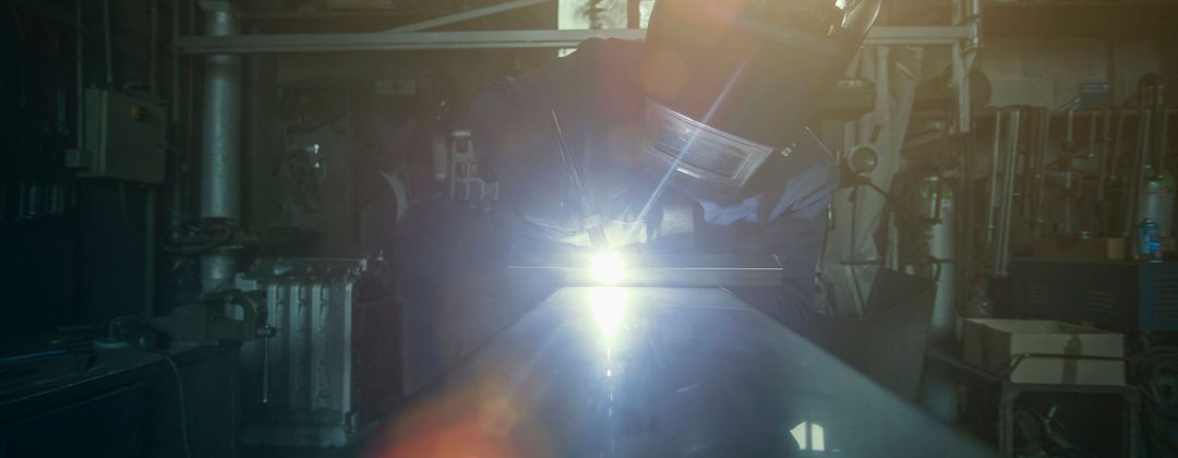 welder-soldering-iron-in-workshop-UNJ7ZDQ